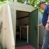 Homeowner Clint Senseman inspects his tornado shelter. Photo by Cody Farris.